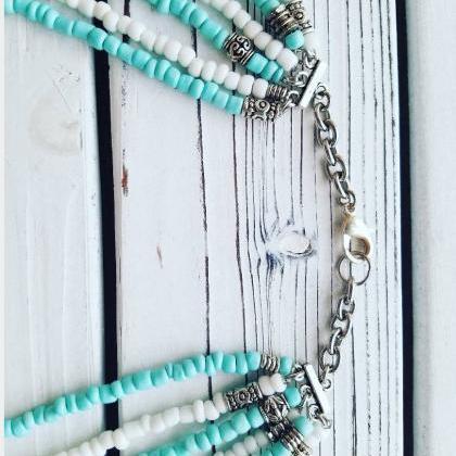 Turquoise And White Beads Multi Strand Layering..